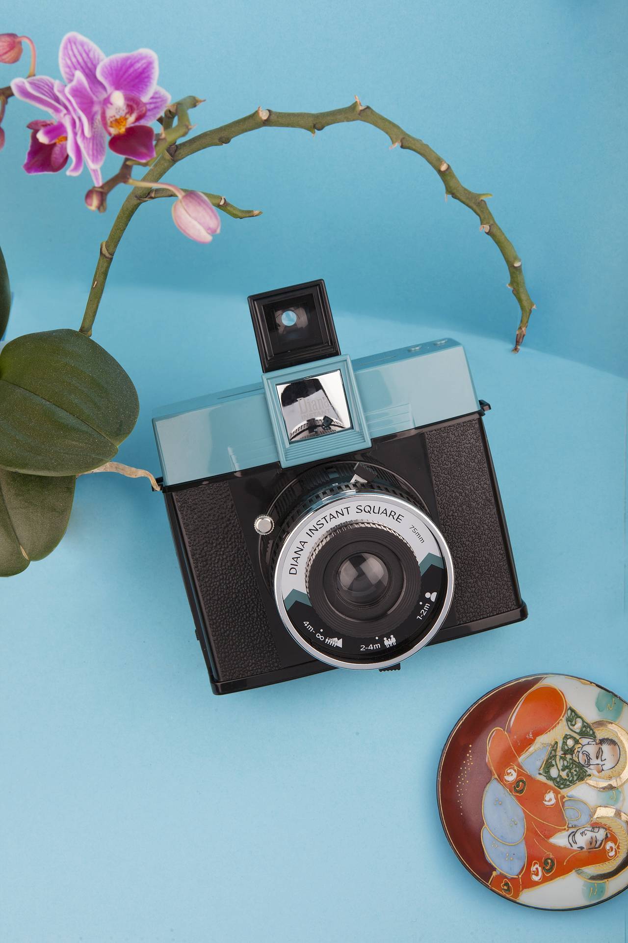 Experience the legendary Diana aesthetic of strong, saturated colors and rich, moody vignetting on Instax Square film with the Diana Instant Square.